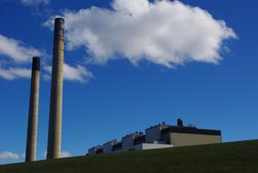 photo of a plant with two industrial chimneys