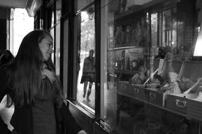 Girl Looking The Dolls at Window