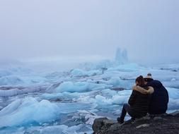 a girl and a guy on the ice