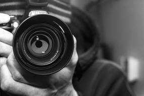 photographer with camera close-up in black and white background