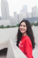 happy girl on the background of urban skyscrapers