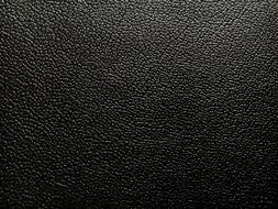 Shiny, black leather texture in light