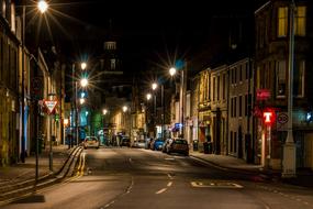 Beautiful cityscape of the city in Scotland, with colorful lights, at the night