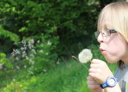 the girl with the glasses and the flower