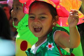 Portrait of the smiling girl, in colorful costume