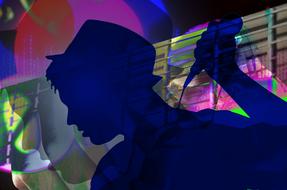 Silhouette of the singer, at background with colorful lights and shapes