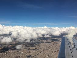 Flight Wing Cloud Over City