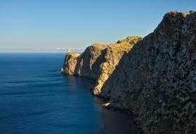 green mountains with sea
