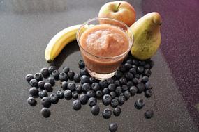 Dessert in cup against a background of fruit