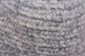 Close-up of the grey and white wool needle bind of different shades