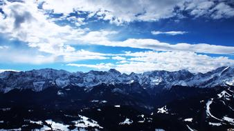 blue landscape of mountains and clouds
