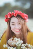 vietnamese girl with red floral wreath on her head