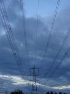 blue dramatic sky above Pylon Cables Electricity