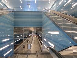 Shiny, blue and white interior of the building, of different shades, with light reflections