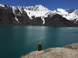 blue lake with a mountain backdrop