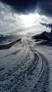 the sun illuminates the snow