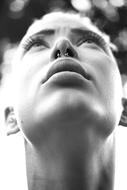 Young Girl with nose piercing looking up