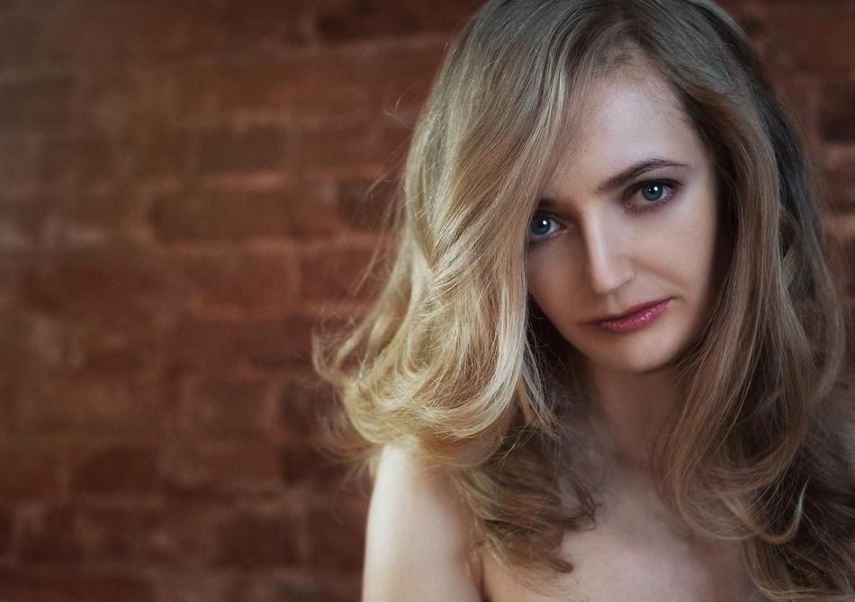 portrait of a blonde in a loft