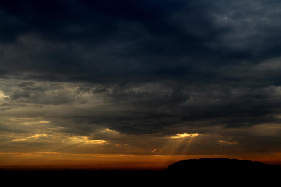 sunset with a silhouette of a field