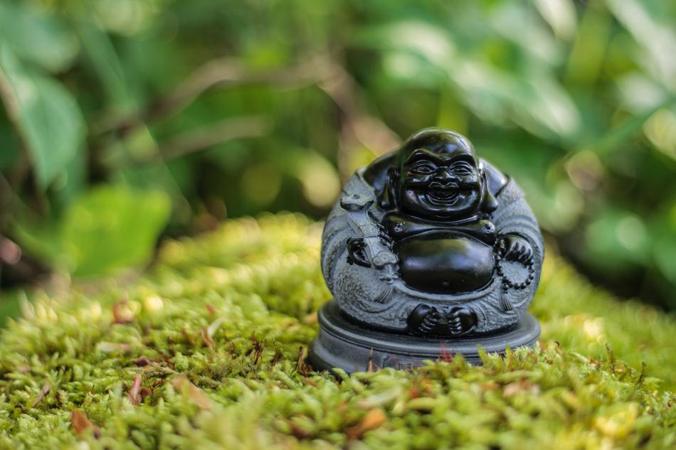 Figurine of Buddha on the grass