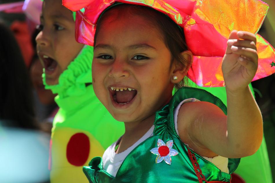 Portrait of the smiling girl, in colorful costume