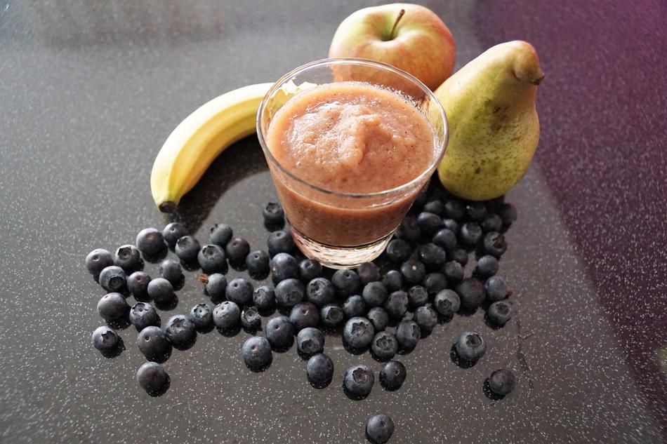 Dessert in cup against a background of fruit