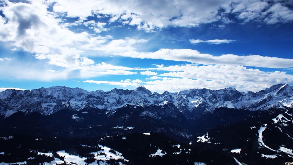blue landscape of mountains and clouds