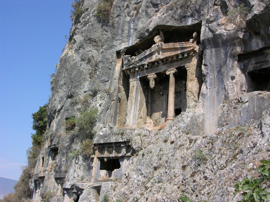 Beautiful temple of Lycia, with pillars and plants, in Fethiye, Turkey, under the blue sky