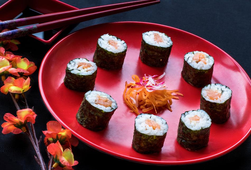 Delicious rolls on a red plate