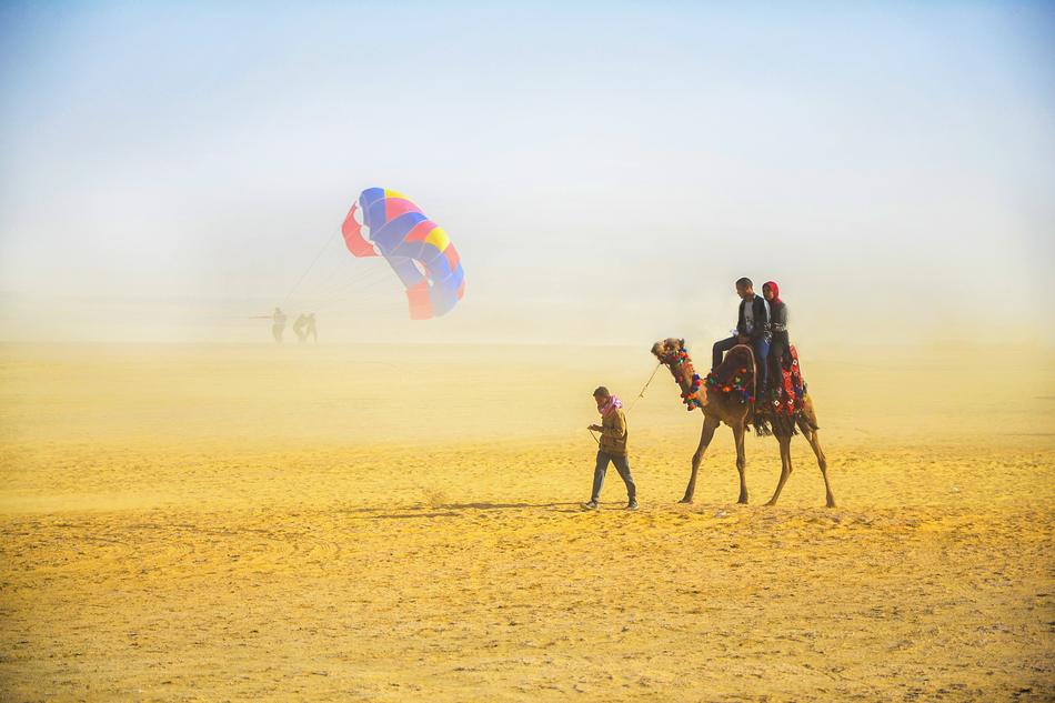 camel and man in the desert
