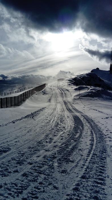 the sun illuminates the snow