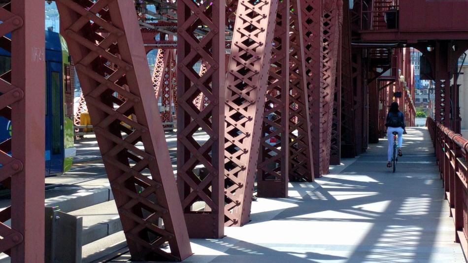 Cyclist Broadway Bridge Red