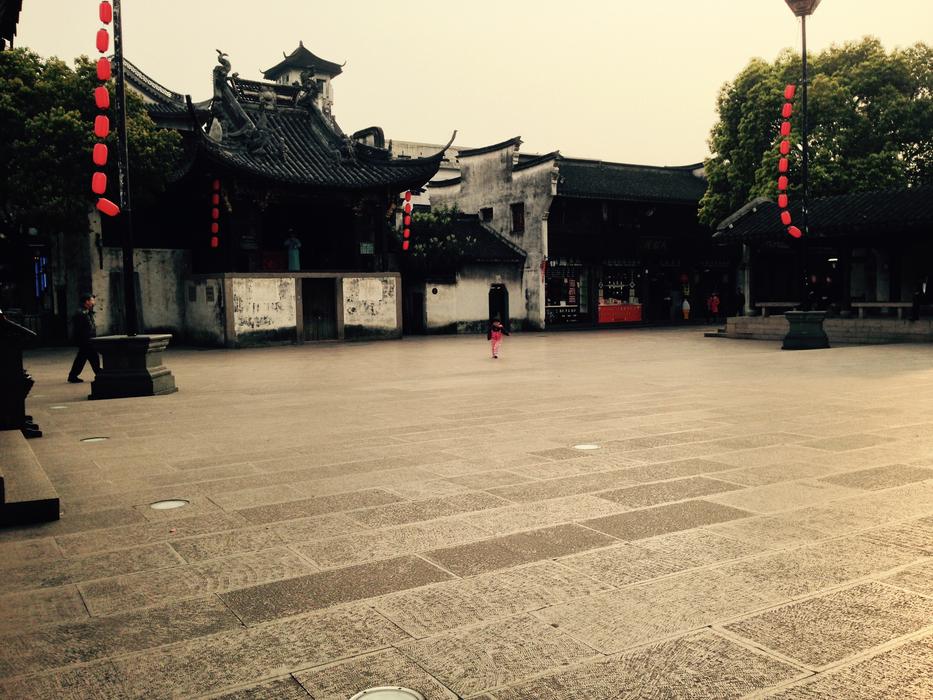 Cityscape with the square near the traditional buildings and trees in Hangzhou, China