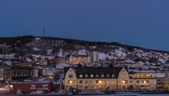 Beautiful landscape of Tromso, Norway, with lights, in snow, in the winter