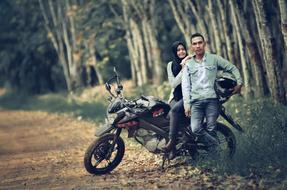 a man and a girl on a motorcycle