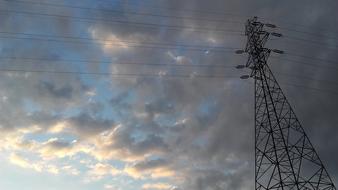 high voltage tower at dusk