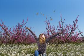 girl on the field with flowers