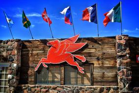 wooden building with flags