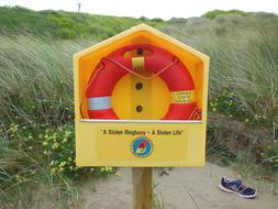 Rescue Ring Buoy in box on sand dune, ireland