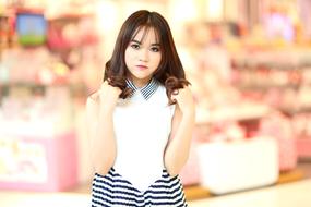 pretty asian Girl with hands on hair