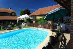 blue pool with houses