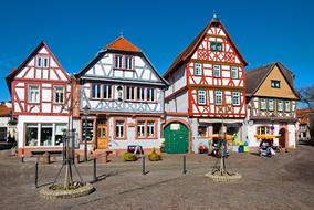 Colorful and beautiful houses on the street in Seligenstadt, Hesse, Germany, under the blue sky