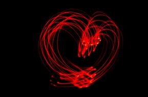 Red heart, with the lines, at black background, clipart