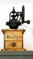 old coffee grinder with a signature