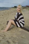 girl on the beach in a fashionable dress