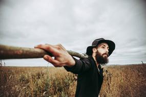 a man with a hat on the field