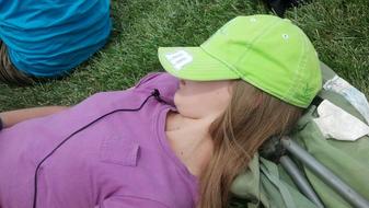 sleeping teenager girl on the grass