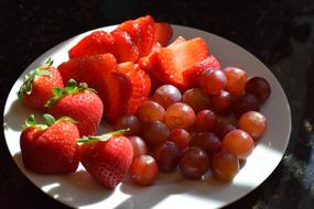 red strawberries and grapes