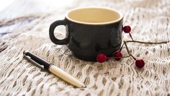 black mug with a handle on the table