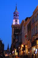 Beautiful street in Kampen, Netherlands, with colorful lights, under the blue sky